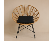 Fauteuil en rotin design rond avec coussin et pieds métal | MELTO